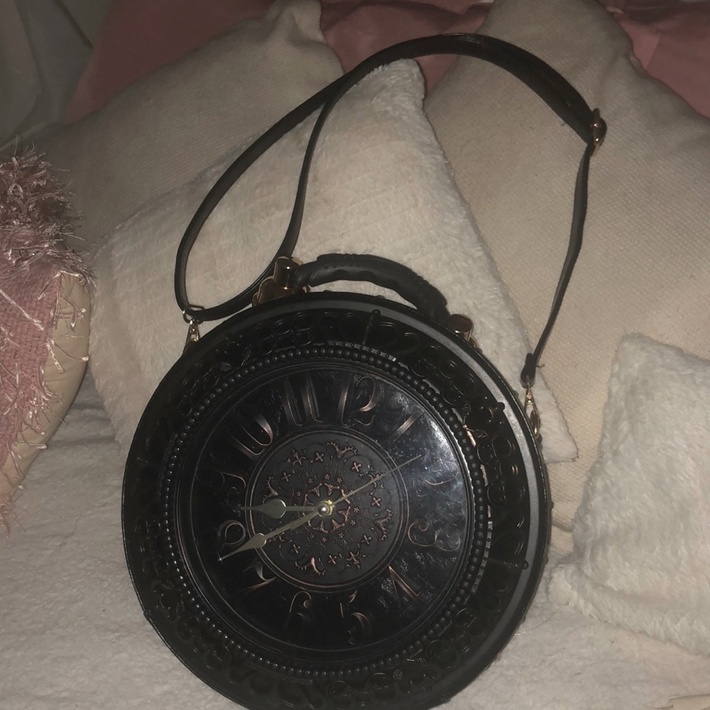 A chocolate medium clock purse. Working clock .